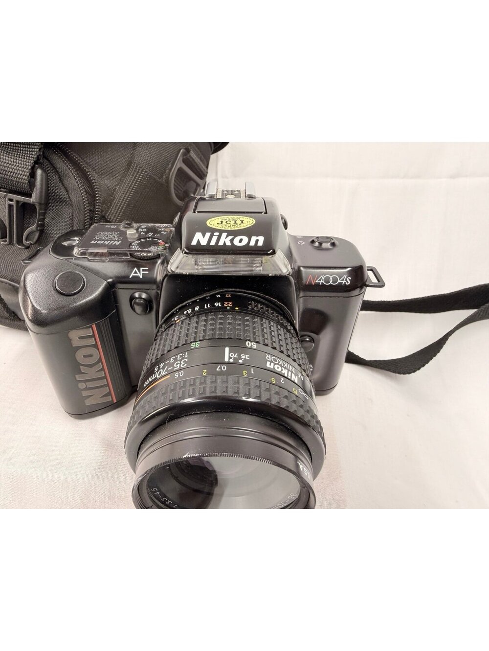 Vintage film Nikon N4004 AF Camera with AF Nikkor 35-70mm 1:3.3-4.5 Lens
